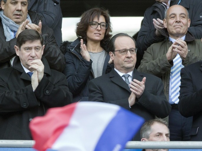 French President Francois Hollande, center, applauds during the Six Nations tournament Rugby match between France and Italy, at Stade de France in Saint-Denis, France, Saturday Feb. 6, 2016. The match will be the first sporting event to be held at the national stadium since it was targeted by terrorists on 13 Nov. This Saturday there will be 250 police and 900 security staff. (AP Photo/Jacques Brinon)