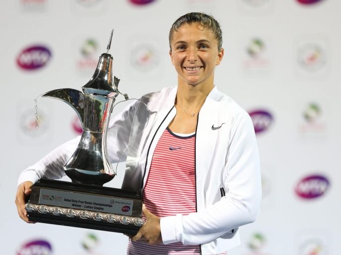 Sara Errani of Italy poses with the trophy after winning the final match against Barbora Strycova of Czech Republic at Dubai Duty Free Tennis WTA Championships in Dubai, United Arab Emirates, 20 February 2016.