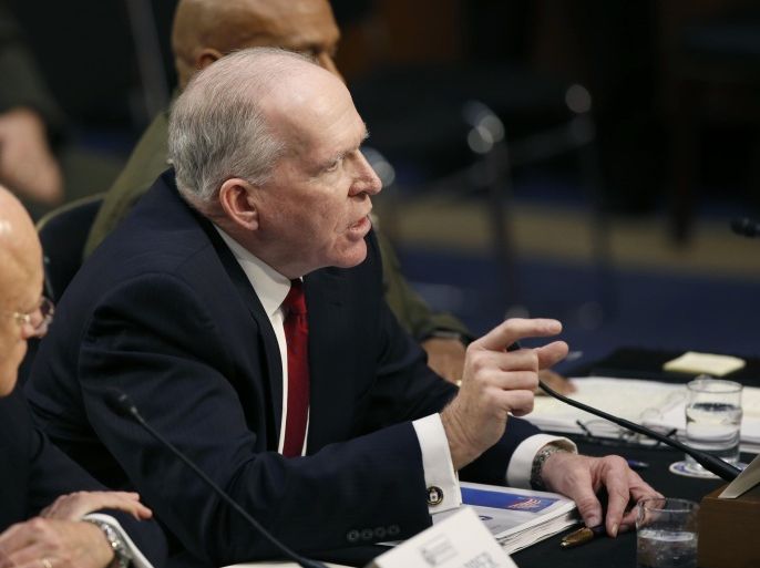 CIA Director John Brennan, flanked by Director of the National Intelligence Director James Clapper, left, and Defense Intelligence Agency Director Lt. Gen. Vincent Stewart, testifies on Capitol Hill in Washington, Tuesday, Feb. 9, 2016, before Senate Intelligence Committee hearing on worldwide threats. (AP Photo/Alex Brandon)