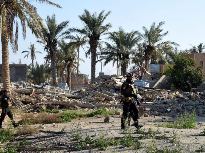 A picture made available on 05 February 2016, shows Iraqi soldiers patrolling an area at Sijariya district near Ramadi city, western Iraq, on 04 February 2016. Media reports state that at least 22 Iraqi soldiers were killed in a triple suicide attack on a military base west of Ramadi, the capital of turbulent Anbar province. Suicide bombers blow themselves up inside Ayn Al Asad air base western Ramadi ciry, a military official said. In December 2015, the Iraqi government announced the 'liberation' of Ramadi from Islamic State, marking the first major setback for the al-Qaeda breakaway group since April.
