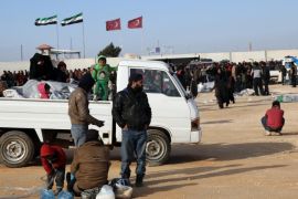 In this photo provided by Turkey's Islamic aid group of IHH, Syrians fleeing the conflicts in Azaz region, wait at the Bab al-Salam border gate, Syria, Friday, Feb. 5, 2016. Turkish officials say thousands of Syrians have massed on the Syrian side of the border seeking refuge in Turkey. Officials at the government’s crisis management agency said Friday it was not clear when Turkey would open the border to allow the group in and start processing them. The refugees who fled bombing in Aleppo, were waiting at the Bab al-Salam crossing, opposite the Turkish province of Kilis.(IHH via AP)