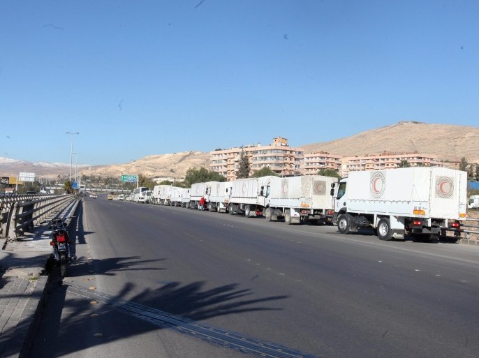 Trucks with relief goods stand in front of the United Nations Relief and Works Agency (UNRWA) offices in Damascus, Syria, 17 February 2016. Around 73 trucks loaded with food, infant formula and medicines, in addition to a mobile clinic and a medical team, will head to the besieged rebel-held towns of Madaya, al-Zabadani and al-Moadhamiya, as part of a UN sponsored aid operation in the war-torn country. A similar convoy of 25 trucks, a mobile clinic and a medical team, headed to the villages of Foua and Kfraya in the northern Idlib, which are besieged by rebels. The convoys are the third humanitarian aid delivery to the besieged areas after two similar efforts last month.