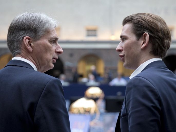 Britain’s Foreign Minister Philip Hammond, left, talks to Austria's Foreign Minister Sebastian Kurz at the start of an informal EU foreign ministers meeting at the Maritime Museum in Amsterdam, Netherlands, Friday, Feb. 5, 2016. (AP Photo/Peter Dejong)