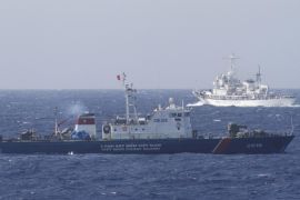 A ship (top) of the Chinese Coast Guard is seen near a ship of the Vietnam Marine Guard in the South China Sea, off shore of Vietnam in this May 14, 2014 file photo. The United States and India have held talks about conducting joint naval patrols that a U.S. defence official said could include the disputed South China Sea, a move that would likely anger Beijing, which claims most of the waterway. To match Exclusive SOUTHCHINASEA-INDIA/USA REUTERS/Nguyen Minh/Files
