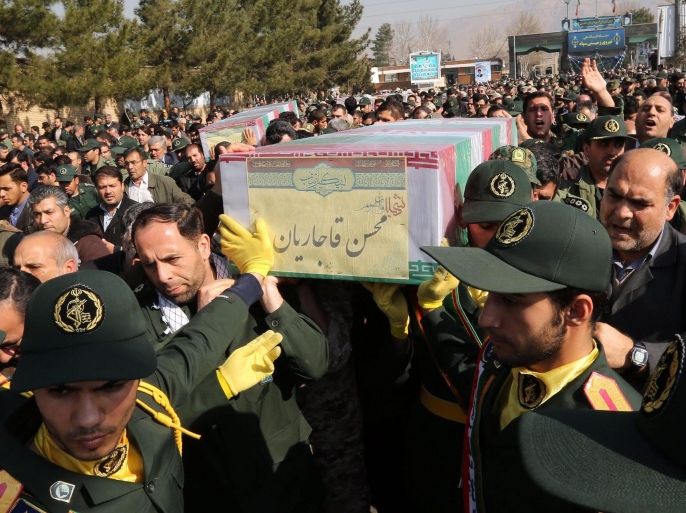 Members of the Iranian Revolutionary Guard carry the coffins of Iran's Revolutionary Guard Brigadier General Mohsen Ghajarian and other Iranian 'volunteers', who were reportedly killed in the northern province of Aleppo in the fight against the Islamic State (IS), during their funeral ceremony in the Tehran, Iran, 06 February 2016.