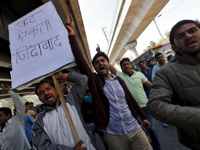 Demonstrators from the Jat community shout slogans during a protest in New Delhi, India, February 21, 2016. India deployed thousands of troops in a northern state on Sunday to quell protests that have severely hit water supplies to Delhi, a city of more than 20 million people, forced factories to close and killed 10 people. The rioting in Haryana by the Jats, a rural caste, is symptomatic of increasingly fierce competition for government jobs and educational openings in India, whose growing population is set to overtake China's within a decade. The placard reads, "Long live Jat unity". REUTERS/Adnan Abidi