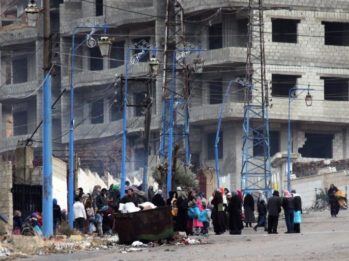 People stand in the besieged town of Madaya, in the countryside of Damascus, Syria, 14 January 2016. Convoys of humanitarian supplies, the second in a week, were on their way to three besieged Syrian towns. Some 44 trucks will enter the rebel-held town of Madaya near the capital Damascus and 17 others will enter the government-controlled towns of Foua and Kefraya in north-western Syria, the International Committee of the Red Cross (ICRC) said. Reports of starvation in Madaya, a mountain town near the Lebanese border, had triggered a global outcry. The aid deliveries were arranged under a UN-sponsored deal between government and rebel forces.