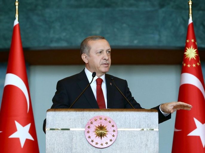 Turkey's President Tayyip Erdogan addresses the audience during a meeting in Ankara, Turkey, January 12, 2016. Erdogan said on Tuesday that Russia was preparing the ground to create a 'boutique' Syrian state around the northern province of Latakia and that it has been carrying out attacks against Turkmens there. In a speech to Turkish ambassadors in Ankara, Erdogan also slammed Iran, saying Tehran was using developments in countries like Syria, Iraq and Yemen to expand its sphere of influence and that it was trying to spark a dangerous process with a stance turning sectarian differences into conflict. REUTERS/Kayhan Ozer/Presidential Palace Press Office/Handout via Reuters ATTENTION EDITORS - THIS PICTURE WAS PROVIDED BY A THIRD PARTY. REUTERS IS UNABLE TO INDEPENDENTLY VERIFY THE AUTHENTICITY, CONTENT, LOCATION OR DATE OF THIS IMAGE. THIS PICTURE IS DISTRIBUTED EXACTLY AS RECEIVED BY REUTERS, AS A SERVICE TO CLIENTS. FOR EDITORIAL USE ONLY. NOT FOR SALE FOR MARKETING OR ADVERTISING CAMPAIGNS. EDITORIAL USE ONLY. NO RESALES. NO ARCHIVE.