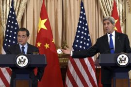 Secretary of State John Kerry, right, speaks during a media availability with Chinese Foreign Minister Wang Yi, left, at the State Department in Washington, Tuesday, Feb. 23, 2016.(AP Photo/Susan Walsh)