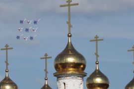 MiG-29 jet fighters of the Strizhi (Swifts) and Sukhoi Su-27 jet fighters of the Russkiye Vityazi (Russian Knights) aerobatic teams perform near an Orthodox church during a demonstration flight at the MAKS International Aviation and Space Salon in Zhukovsky outside Moscow, Russia in this August 28, 2013 file photo. The MAKS International Aviation and Space Salon 2015 is expected to open in Russia this week. REUTERS/Tatyana Makeyeva/Files GLOBAL BUSINESS WEEK AHEAD PACKAGE - SEARCH "BUSINESS WEEK AHEAD AUGUST 24" FOR ALL IMAGES