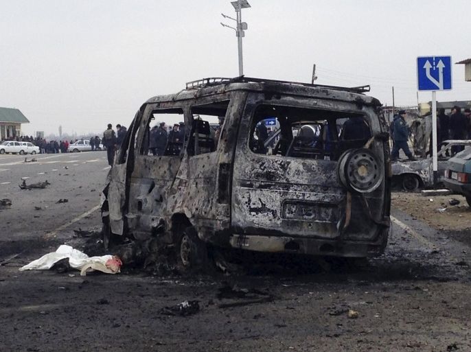 ATTENTION EDITORS - VISUAL COVERAGE OF SCENES OF DEATH A view shows a burnt vehicle near a damaged traffic checkpoint near the town of Derbent in Dagestan's southeast, Russia, February 15, 2016. A car bomb killed two policemen at a traffic checkpoint in Russia's volatile republic of Dagestan on Monday, local media reported, quoting law enforcement officers, and some security officials blamed a suicide bomber from a local extremist group. REUTERS/Stringer EDITORIAL USE ONLY. NO RESALES. NO ARCHIVE