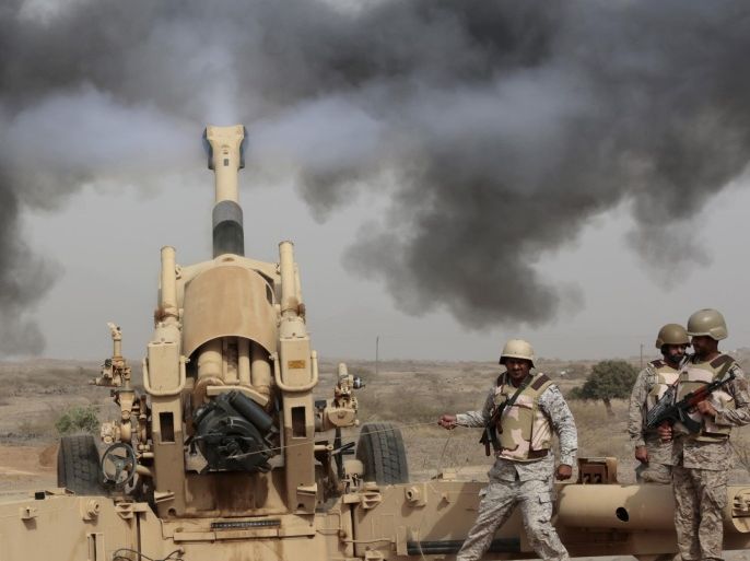 FILE - In this April 20, 2015 file photo, Saudi soldiers fire artillery toward three armed vehicles approaching the Saudi border with Yemen in Jazan, Saudi Arabia. Saudi Arabia’s offer to put boots on the ground to fight Islamic State in Syria is as much about the kingdom’s growing determination to flex its military might as it is about answering U.S. calls for more help from Mideast allies. (AP Photo/Hasan Jamali, File)