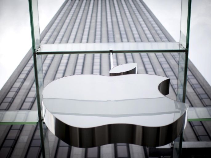An Apple logo hangs above the entrance to the Apple store on 5th Avenue in the Manhattan borough of New York City, in this July 21, 2015, file photo. Apple Inc said on September 20, 2015, it is cleaning up its iOS App Store to remove malicious iPhone and iPad programs identified in the first large-scale attack on the popular mobile software outlet. REUTERS/Mike Segar/Files