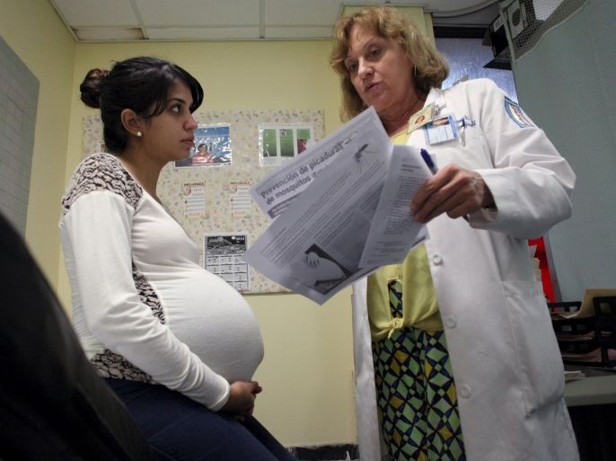 Nancy Trinidad, who is 32 weeks pregnant, listens to the explanation of a doctor about how to prevent Zika, Dengue and Chikungunya viruses at a public hospital in San Juan, Puerto Rico, February 3, 2016. REUTERS/Alvin Baez