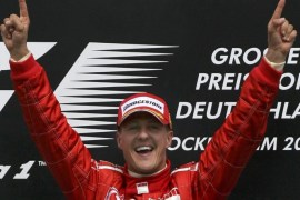 Ferrari driver Michael Schumacher of Germany celebrates after winning the German Grand Prix in Hockenheim, in this July 30, 2006 file picture. Formula One supremo Bernie Ecclestone is keeping the door ajar for German Grand Prix organisers even if this year's race looks doomed.   REUTERS/Ruben Sprich/Files (GERMANY  - Tags: SPORT MOTORSPORT)