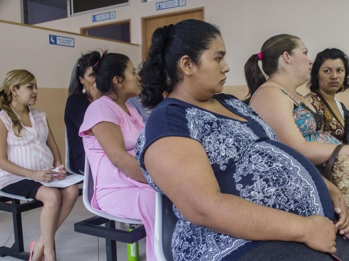 In this Jan. 29, 2016 photo, women wait their turn for their pre-natal exams at the National Hospital for Women in San Salvador, El Salvador. In the Central American nation authorities have urged women to put off pregnancy for two years after it was reported that there may be a possible link between mosquito-borne Zika and microcephaly, in which infants are born with unusually small heads and can sometimes suffer mental retardation or a host of serious health and developmental problems. (AP Photo/Salvador Melendez)