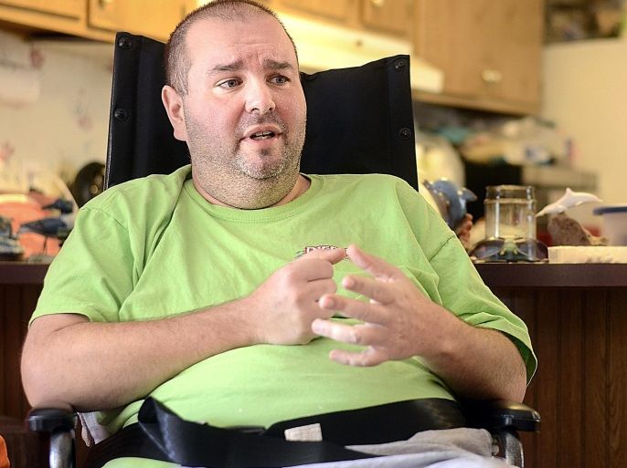 ADVANCED FOR RELEASE MONDAY, FEBRUARY 16, 2015 Paul Leonard expresses his frustration about his condition, Guillain-Barre Syndrome, which has left him wheelchair-bound and stranded in his home because of paralysis. (AP Photo/Hickory Daily News, Robert C. Reed)