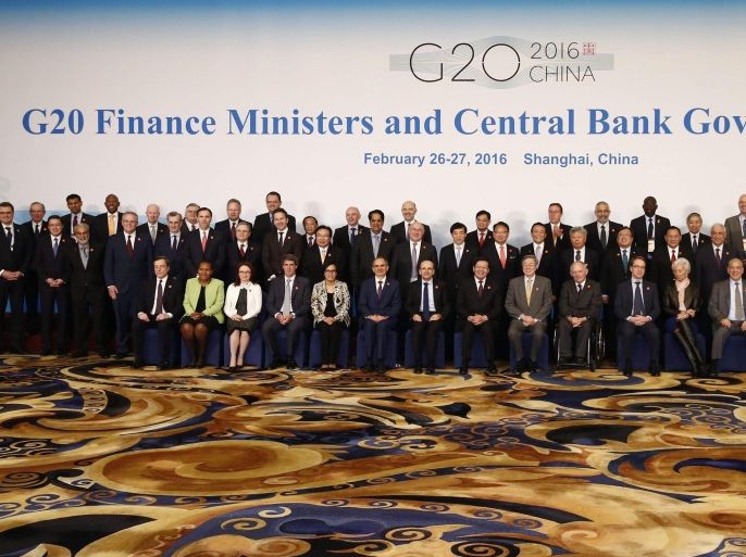 Officials led by host country officials Chinese Finance Minister Lou Jiwei (front 8-L) and People's Bank of China Governor Zhou Xiaochuan (Front 9-L) pose for a family photo of G20 Finance Ministers and Central Bank Governors Meeting at the Pudong Shangri-la Hotel in Shanghai, China, 27 February 2016. Finance officials from G20 member countries are meeting in Shanghai from 26 to 27 February, aiming to formulate reforms for economic growth and strengthen cooperation.