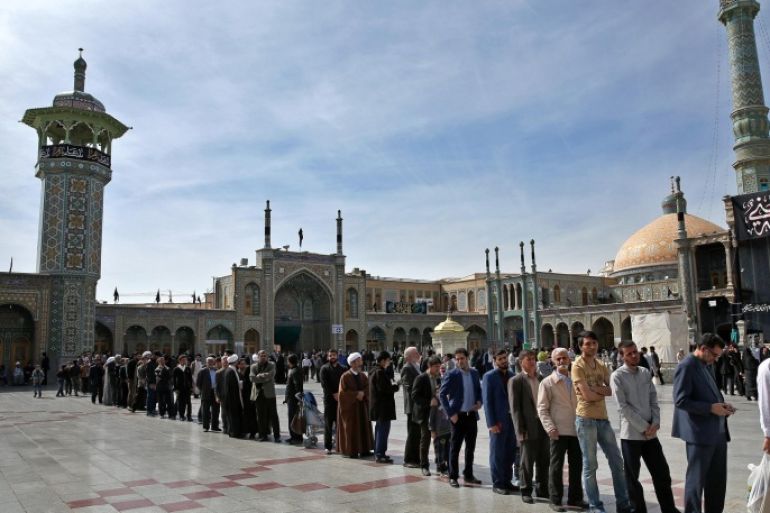 Iranians stand in line at a polling station during the parliamentary and Experts Assembly elections in Qom, 125 kilometers (78 miles) south of the capital Tehran, Iran, Friday, Feb. 26, 2016. Iranians across the Islamic Republic voted Friday in the country's first election since its landmark nuclear deal with world powers, deciding whether to further empower its moderate president or side with hard-liners long suspicious of the West. The election for Iran's parliament and a clerical body known as the Assembly of Experts hinges on both the policies of President Hassan Rouhani, as well as Iranians worries about the country's economy, long battered by international sanctions. (AP Photo/Ebrahim Noroozi)