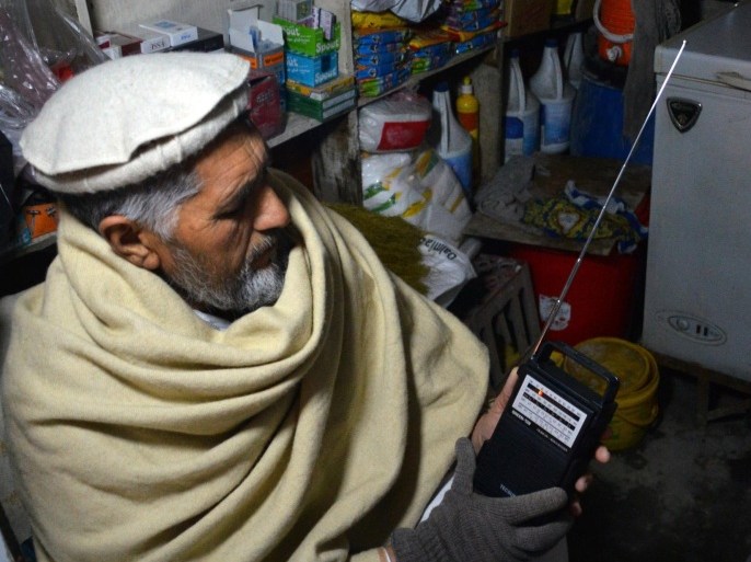 In this photo taken on Sunday, Jan. 10, 2016, an Afghan shopkeeper, listens to Islamic State Radio at his shop in Jalalabad, capital of Nangarhar province, Afghanistan. The Islamic State group in Afghanistan has adopted the media strategy of its mother organization in Syria and Iraq, including the production of grisly, professionally made videos showing battles and the killing of captives. But in impoverished Afghanistan, where few have access to the Internet, radio could prove more effective at recruiting fighters and silencing critics. (AP Photos/Mohammad Anwar Danishyar)