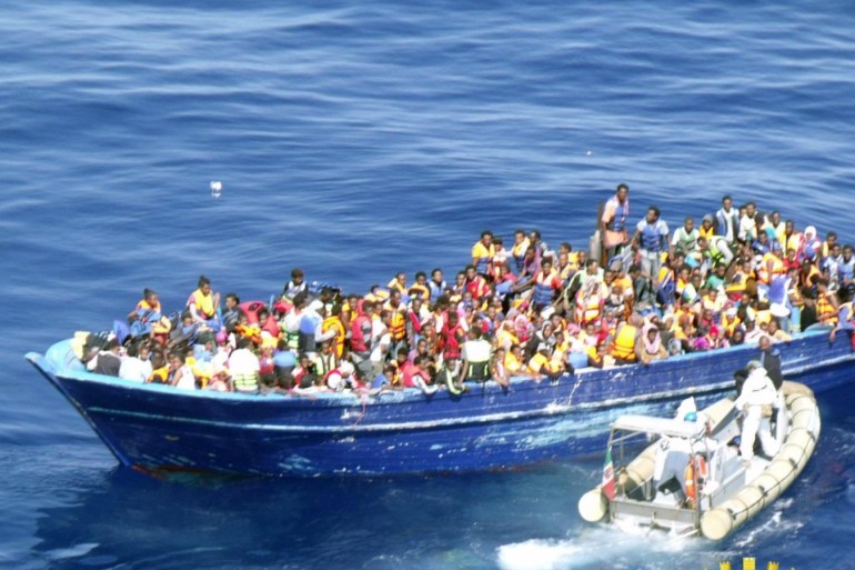 A handout image released by Italian Navy on 22 August 2015 of a boat crowded with refugees off the Italian coast in the Strait of Sicily, 22 August 2015. At least 4,000 migrants are being rescued in several large-scale operations in the central Mediterranean, Italian authorities said 22 August 2015. The Italian navy and customs police, as well as a Norwegian vessel part of the Triton border patrol mission, which is coordinated by the European Union, were said to be helping rescue efforts.  EPA/ITALIAN NAVY PRESS OFFICE / HANDOUT