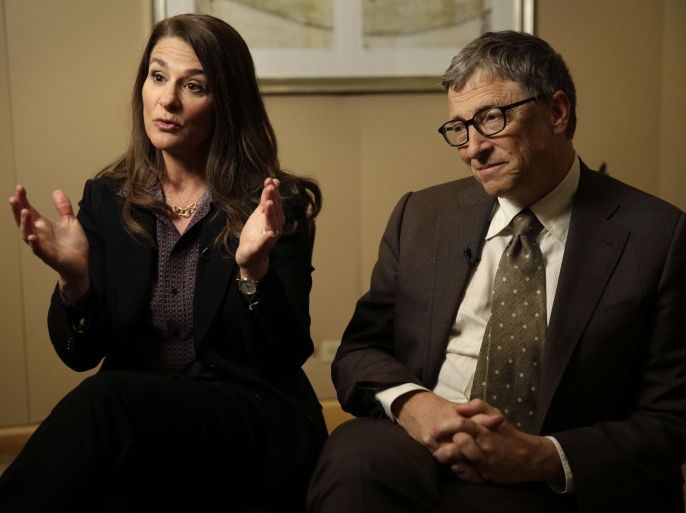 Bill Gates listens while his wife Melinda Gates talks during an interview in New York, Wednesday, Jan. 21, 2015. As the world decides on the most crucial goals for the next 15 years in defeating poverty, disease and hunger, the $42 billion Gates Foundation announces its own ambitious agenda. (AP Photo/Seth Wenig)