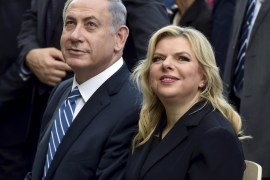 Israel's Prime Minister Benjamin Netanyahu (L) sits next to his wife Sara during a visit at the Expo 2015 global fair in Milan, northern Italy, in this August 27, 2015 file picture. REUTERS/Flavio Lo Scalzo/Files