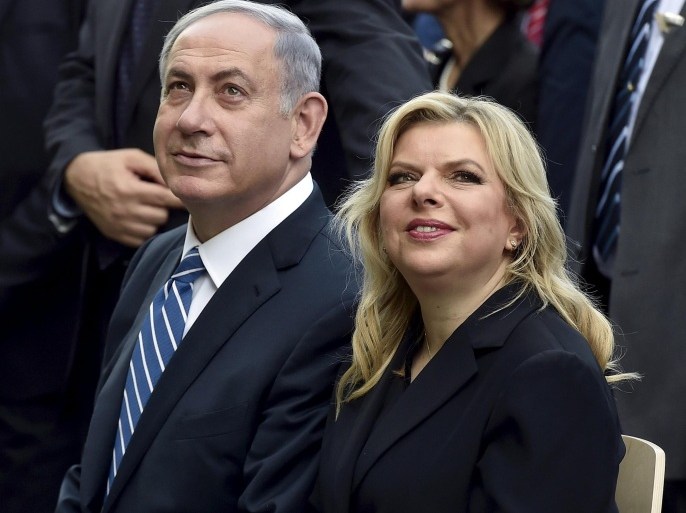Israel's Prime Minister Benjamin Netanyahu (L) sits next to his wife Sara during a visit at the Expo 2015 global fair in Milan, northern Italy, in this August 27, 2015 file picture. REUTERS/Flavio Lo Scalzo/Files