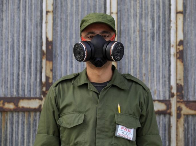 Eloy, 38, a Cuban military reservist who is working in a fumigation campaign against Aedes aegypti mosquito, posses for a picture in Havana February 22, 2016. Cuban President Raul Castro called on the entire Cuban population to help eradicate the mosquitoes that carry the Zika virus on Monday and ordered 9,000 army troops to help stave off the disease. Cuba has yet to detect a case of Zika but the outbreak is affecting large parts of Latin America and the Caribbean and is likely to spread to all countries in the Americas except for Canada and Chile, the World Health Organization (WHO) has said. REUTERS/Enrique de la Osa