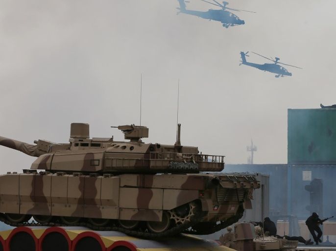 UAE armed forces demonstrate during a military show at the opening ceremony of the International Defence Exhibition and Conference, IDEX, in Abu Dhabi, United Arab Emirates, Sunday, Feb. 22, 2015. (AP Photo/Kamran Jebreili)