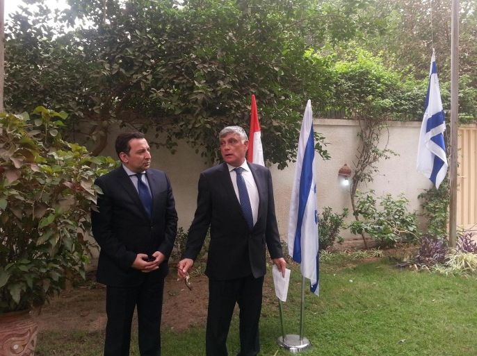 This Wednesday, Sept. 9, 2015 image released on the official Facebook page of the Israeli embassy in Egypt shows Ambassador to Egypt Haim Koren, right, and Ashraf Munir from the Egyptian Foreign Ministry at the re-opening of the embassy in Cairo, Egypt, four years after an Egyptian mob ransacked the site where the mission was previously located.(Israeli embassy in Egypt official Facebook page via AP)