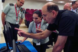A photograph supplied by the Israeli Defense Ministry shows Israeli Defense Minister Moshe Yaalon as he looks at material shown on a computer monitor during a visit to the Israeli Defense Forces cyber warfare unit in Tel Aviv, Israel, 04 June 2013.