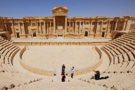 Tourists take pictures at the ancient Palmyra theater in the historical city of Palmyra in this April 18, 2008 file photo. Syrian government forces recaptured Palmyra on March 27, 2016, state media and a monitoring group said, inflicting a significant defeat on the Islamic State group which had controlled the desert city since May last year. REUTERS/Omar Sanadiki/Files