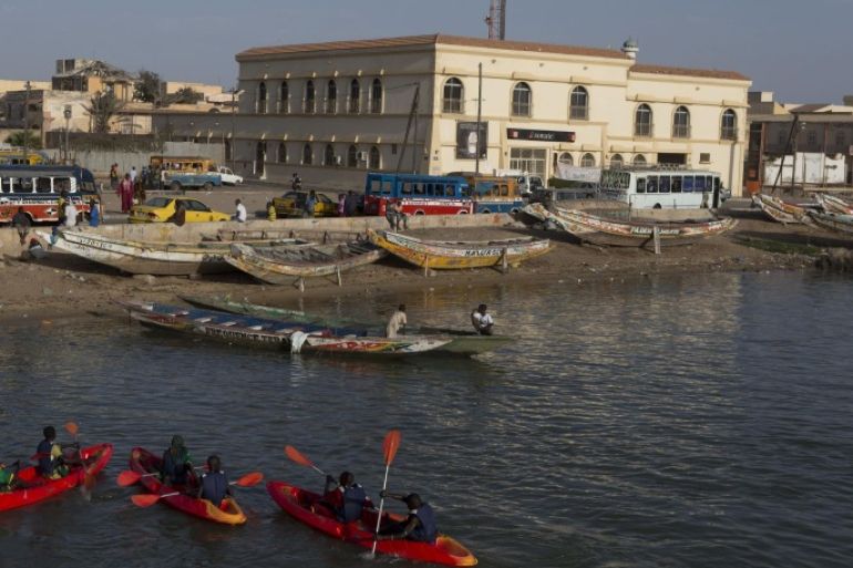 A group of young Senegalese kayak on the Senegal river, in Saint-Louis, Senegal, Saturday, May 18, 2013. Saint-Louis, once the capital of colonial French West Africa, is hosting the 21st edition of its annual Jazz Festival from May 15 to 19. (AP Photo/Rebecca Blackwell)