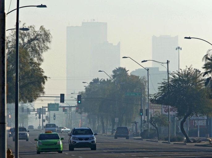 High rises in downtown Phoenix are obscured by smog on Friday, Jan. 1, 2016. (John Samora/The Arizona Republic via AP) MARICOPA COUNTY OUT; MAGS OUT; NO SALES; MANDATORY CREDIT