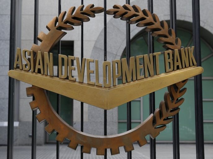The Asian Development Bank (ADB) logo is pictured at the steel fence at its headquarters in Mandaluyong, Metro Manila January 8, 2016. REUTERS/Erik De Castro