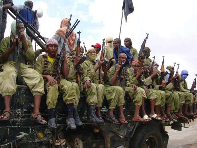 FILE - In this Oct. 30, 2009 file photo, al-Shabab fighters sit on a truck as they patrol in Mogadishu, Somalia. Somalia's intelligence service cooperated with the U.S. in airstrikes that killed more than 150 al-Shabab members on Saturday, an intelligence official said Tuesday, March 8, 2016. The airstrikes targeted a forested military training camp run by the Islamic extremists 200 kilometers (124 miles) north of the capital Mogadishu, the official said, adding that the camp was al-Shabab's main planning base. He said Somali officials helped the U.S. to pinpoint the location of the militants' training base but did not give details. (AP Photo/Mohamed Sheikh Nor, File)