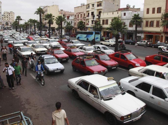 Taxi drivers protesting against a fuel hike bring traffic to a standstill outside the police headquarters in Casablanca's city centre June 11, 2012. Taxi drivers protested on Monday against a hike in fuel prices implemented by Moroccan Prime Minister Abdelilah Benkirane's government. REUTERS/Macao (MOROCCO - Tags: TRANSPORT BUSINESS POLITICS ENERGY)