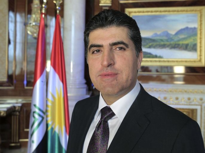 Nechervan Barzani, prime minister of Iraq's semi-autonomous Kurdish region, poses for a photo during an interview with The Associated Press in Irbil, Iraq, Sunday, Nov. 2, 2014. Barzani said Iraqi Kurdish forces will only stay in Syria "temporarily" as they seek to help defend the city of Kobani from militants with the Islamic State group. (AP Photo/Bram Janssen)