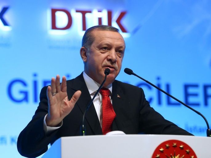 Turkish President Recep Tayyip Erdogan addresses a meeting in Istanbul, Saturday, March 26, 2016. Erdogan has criticized foreign diplomats who attended the trial of two prominent journalists Can Dundar and Erdem Gul who are accused of espionage and terror charges for their reports, and Erdogan accused the diplomats present at the opening hearing of "violating" boundaries and siding with those want to carry out "a coup" against the government. (Kayhan Ozer, Presidential Press Service, Pool via AP)