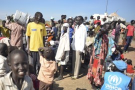 In this photo taken Monday, June 29, 2015, newly-arrived displaced people register to receive food and other aid at the UN base in Bentiu, South Sudan. South Sudan’s army has burned people alive, raped and shot girls, and forced tens of thousands from their homes, according to interviews with survivors by The Associated Press and corroborated by human rights groups. (AP Photo/Jason Patinkin)