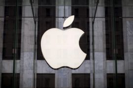 An Apple logo hangs above the entrance to the Apple store on 5th Avenue in New York City, in this file photo taken July 21, 2015. After months of declines in Apple's stock, sentiment appears to be mending as investors focus on steady earnings expectations and bet that the expected launch of a new iPhone will add badly-needed fuel to sputtering sales. REUTERS/Mike Segar/Files