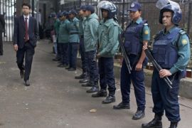 Bangladeshi policemen stand guard outside a special court during the trial of people allegedly involved in killing, kidnapping and looting during the country's independence war against Pakistan in 1971, in Dhaka, Bangladesh, Tuesday, Feb. 2, 2016. Twenty-five people have been convicted since a special tribunal was set up by the government in 2010. (AP Photo)