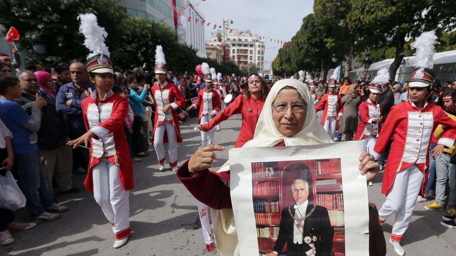 A Tunisian woman holds the picture of the first Tunisian president, Habib Bourguiba during a celebration to commemorate Tunisian National Day in Tunis, Tunisia, 20 March 2016. The day commemorates the country's independence from France in 1956.