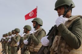(FILE) A file photo dated 06 February 2016 shows Tunisian soldiers posing during a presentation of the anti-jihadi fence close to the border with Libya, near Ben Guerdane, eastern Tunisia. According to a joint statement by the Interior and Defence ministries in Tunisia on 07 March 2016, at least 26 were dead after clashes between Tunisian security forces and unidentified insurgents near the border with Libya. Six terrorist suspects were arrested and 21 killed during the clashes, which erupted in the Tunisian border town of Ben Gardane, the statement added.