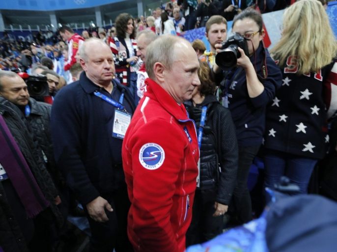 Russian president Vladimir Putin (C) attends the Ice Dance Free Dance of the Figure Skating team event at the Iceberg Skating Palace during the Sochi 2014 Olympic Games, Sochi, Russia, 09 February 2014.