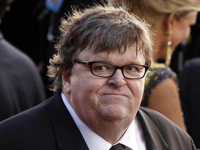 FILE- In this Feb. 26, 2012, file photo, filmmaker Michael Moore arrives before the 84th Academy Awards in the Hollywood section of Los Angeles. Moore has filed for divorce after 21 years of marriage to Kathleen Glynn, his collaborator on the Oscar-winning "Bowling for Columbine" and other projects. A final hearing is scheduled for Sept. 10, 2013. (AP Photo/Joel Ryan, File)