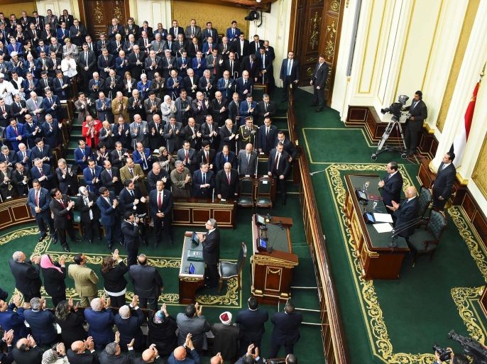 A handout photograph made available by the Egyptian Presidency shows Egyptian President Abdel Fattah al-Sisi (2-R) being greeted by lawmakers as he stands with Speaker of the Egyptian Parliament Ali Abdel-Al (R) at the Parliament, in Cairo, Egypt, 13 February 2016. Al-Sisi on 13 February delivered his first speech in front of the newly convened parliament. The 569-member assembly met for its inaugural session on 10 January 2016. EPA/EGYPTIAN PRESIDENCY/HANDOUT