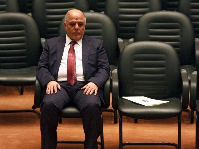 (FILE) A file picture dated 08 September 2014 of Iraqi Prime Minister Haider al-Abadi (L) waiting for the members of his new cabinet to arrive during a parliament session in Baghdad, Iraq. Al-Abadi on 16 August 2015 slashed his cabinet from 33 members to 22, days after parliament approved a slate of reforms he proposed in the wake of protests over corruption and poor public services. EPA/ALI ABBAS *** Local Caption *** 51560339