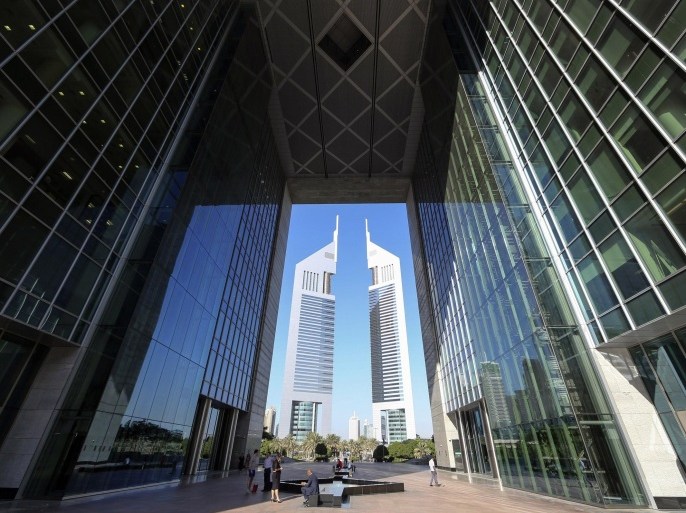 People are pictured at the Dubai International Financial Centre in this November 10, 2013 file photo. Islamic banking is based on core principles of the religion. So it is striking that some banks are removing the word "Islam" from their names - a sign of both the potential of Islamic finance to grow, and the obstacles to it becoming mainstream. REUTERS/Omr Mohamed/Files (UNITED ARAB EMIRATES - Tags: BUSINESS)